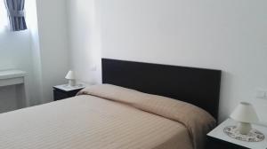 Postel nebo postele na pokoji v ubytování Le Casette