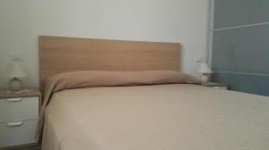 Postel nebo postele na pokoji v ubytování Le Casette