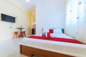 Giường trong phòng chung tại RedDoorz Premium @ Casa Ghilda Resort Olongapo City +61 ảnh