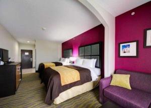 a hotel room with two beds and a couch at Comfort Inn & Suites Tulsa I-44 West - Rt 66 in Tulsa