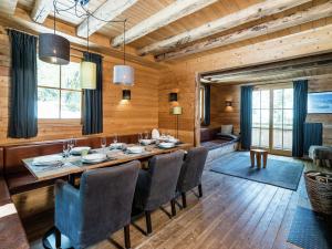 a dining room with a table and chairs at Chalet with Views, Privacy & Fire in Kaprun in Kaprun +12 photos