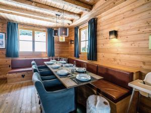 a dining room with a long table and chairs at Chalet with Views, Privacy & Fire in Kaprun in Kaprun