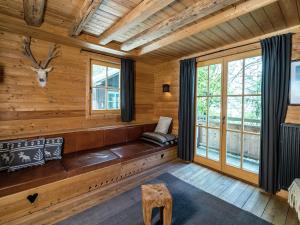 a room with a bench in a log cabin at Chalet with Views, Privacy & Fire in Kaprun in Kaprun