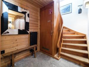 a room with a wooden staircase and a wooden stair case at Chalet with Views, Privacy & Fire in Kaprun in Kaprun
