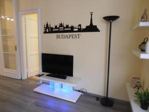 a living room with a flat screen tv on a wall at Budapest Parlament Welcome Apartment in Budapest