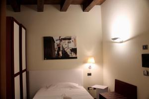 Ліжко або ліжка в номері Il Borgo Ospitale - Albergo Diffuso