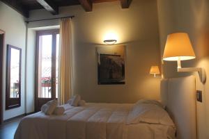 Ліжко або ліжка в номері Il Borgo Ospitale - Albergo Diffuso