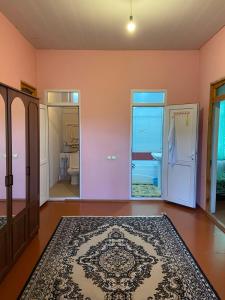 an empty room with a door and a rug at Holiday home in Qusar