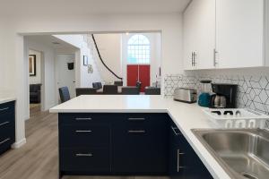 a kitchen with a sink and a counter top at Santa Monica Beach Retreat with Hot Tub, Billiards & Grill in Los Angeles