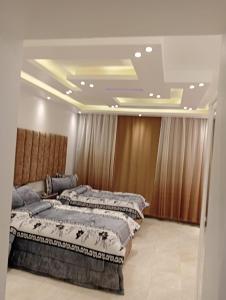 Ένα ή περισσότερα κρεβάτια σε δωμάτιο στο House of Happiness Level 2