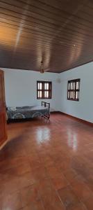 an empty room with a bed in the middle of it at Traditional Kerala house, Kannur-Thalassery in Tellicherry