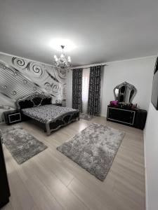 a living room with a bed and a mirror at Ancuta in Afumaţi