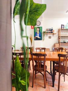 a dining room with wooden tables and chairs at La PenAlta - Allotjament enoturístic - Vilanova de Prades in Vilanova de Prades +20 photos