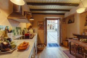 a kitchen with a counter with fruits and vegetables on it at Casa Bella Vista Zufre in Zufre