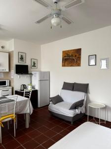 a living room with a couch and a refrigerator at Landscapesilvia 1 Aria in Menaggio