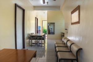 a waiting room with chairs and a table at Aroha Hostel in Coron +13 photos