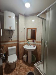 a bathroom with a toilet and a sink at Apartment Aleksic Becici in Bečići
