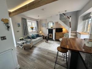 a living room with a couch and a table at Tranquil Seabreeze in Seaview