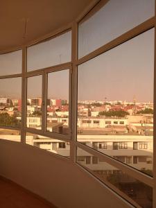 a view of a city from an office window at Appartement à usage familial in Agadir