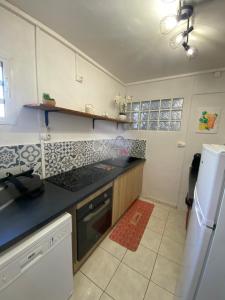 Η κουζίνα ή μικρή κουζίνα στο Case des Deux-Caps - Proxi Plage et marché +11 φωτογραφίες