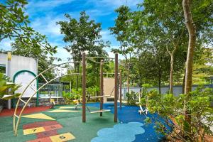 a playground in a garden with a swing at The Pureloft Suites - Bukit Bintang KLCC in Kuala Lumpur +18 photos