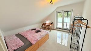 a bedroom with a bed with a ladder and a desk at Himy Home - Moderne Wohnung mit große Dachterrasse in Dormagen +29 photos