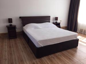 Ένα ή περισσότερα κρεβάτια σε δωμάτιο στο Hotel Simpatia