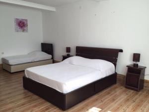 Ένα ή περισσότερα κρεβάτια σε δωμάτιο στο Hotel Simpatia