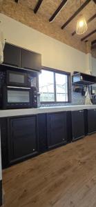 a kitchen with two microwaves and a counter top at Beach House in Chaloklum