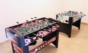 a large foosball table and a foosball at Apartments Villa Milna 1 in Budva