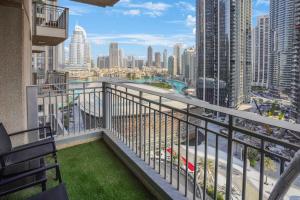 a balcony with a view of the city at 13Stnd- Luxury Living in Downtown Near Burj Khalifa & World Trade Center in Dubai
