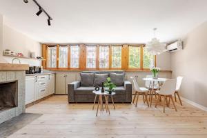 a living room with a couch and a table at Apartment with Fireplace in Old Tbilisi in Tbilisi City