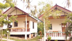 a white house with a gambrel roof at Happy Bungalow in Ko Tao +45 photos
