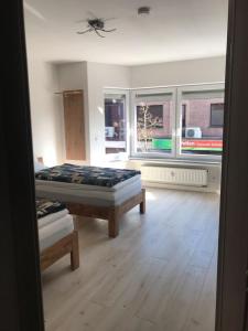 a room with a bed and a large window at Meckenheim in Meckenheim