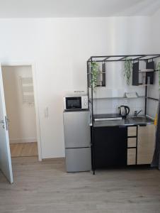 Η κουζίνα ή μικρή κουζίνα στο Wohnen an Seestr +6 φωτογραφίες
