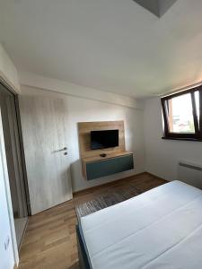 Ένα ή περισσότερα κρεβάτια σε δωμάτιο στο Duplex Apartman Marina Zlatibor