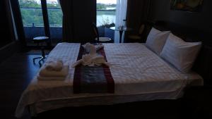 Postel nebo postele na pokoji v ubytování MD Hotel