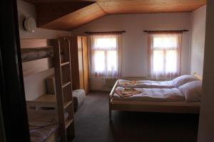Кровать или кровати в номере Pension Martinské údolí