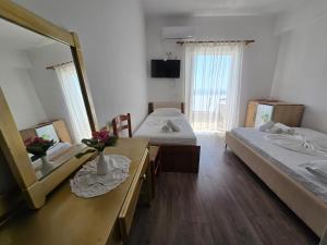 En eller flere senge i et værelse på Vila Teo