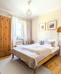 Ένα ή περισσότερα κρεβάτια σε δωμάτιο στο Muelle Sauna Parking Plac zabaw