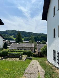a view of a yard with a building and a house at PanoramaVista in Hof bei Salzburg