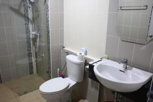 a bathroom with a toilet and a sink at Papaya Stay in Sathani Khlong Rian +21 photos