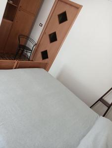 Ένα ή περισσότερα κρεβάτια σε δωμάτιο στο La casa di Riccardo by ROSSELLA'S HOME