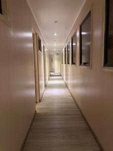 a hallway of a building with a long aisle at Hotel Santiago Yungay in Santiago