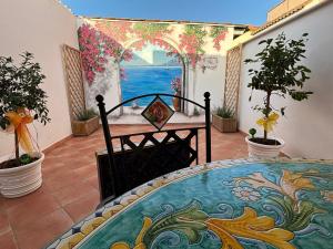 a balcony with a table and a view of the ocean at Casa Vacanze Mary Jane House in Fiumicino
