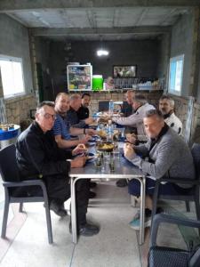 a group of people sitting at a table eating at Auberge baddou amougar in Amouguer