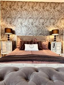 a bedroom with a large bed with two night stands at See U in Szczecin in Szczecin