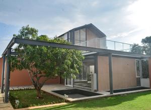 a modern house with a glass roof at Red Apple Farm Villa by Mystic Hotels 
