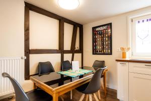 a dining room with a table and chairs at Der Gastfreund in Burghaun in Burghaun
