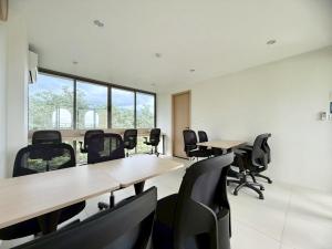 a conference room with tables and chairs and windows at Fantasea Condo - Kamala in Kamala Beach +124 photos